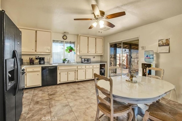 kitchen featuring light tile patterned floors, ceiling fan, black appliances, cream cabinets, and sink