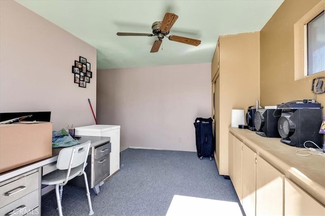 home office with light carpet and a ceiling fan