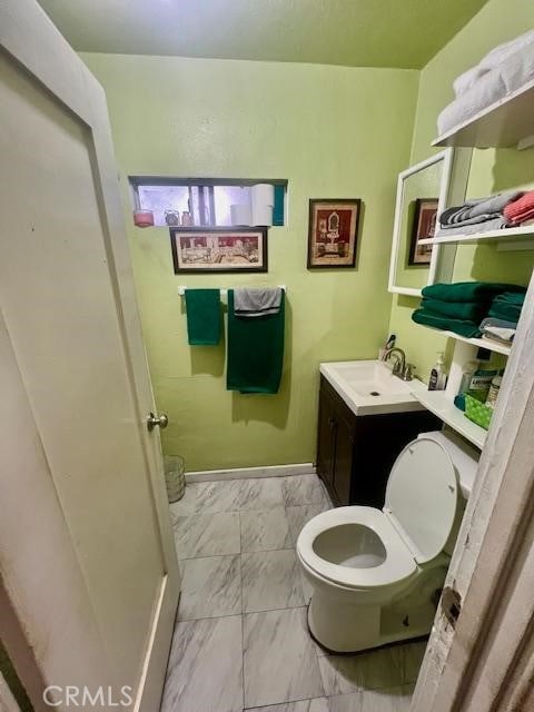 bathroom with toilet and vanity