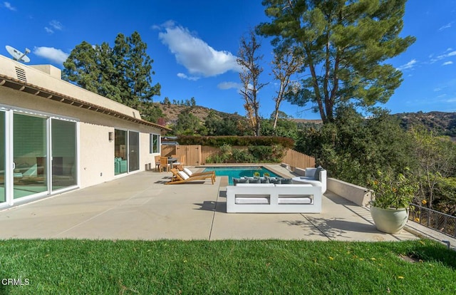 view of pool with a patio area and a mountain view