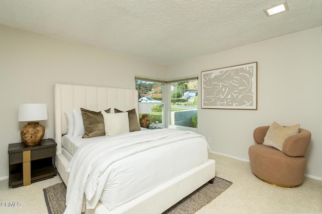 bedroom featuring a textured ceiling