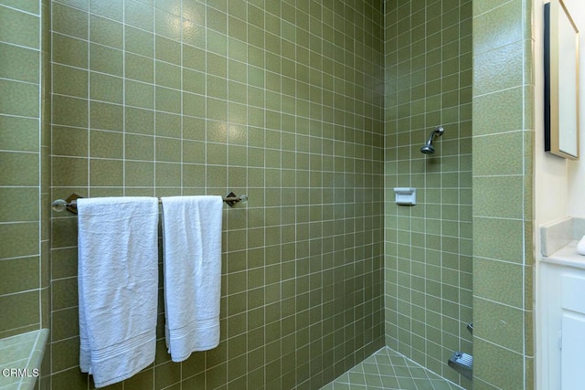 bathroom with tiled shower