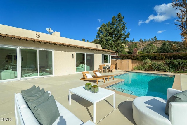 view of pool featuring a patio area and outdoor lounge area