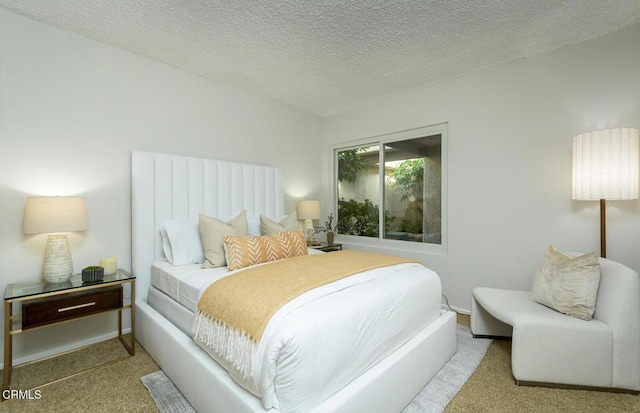 carpeted bedroom with a textured ceiling