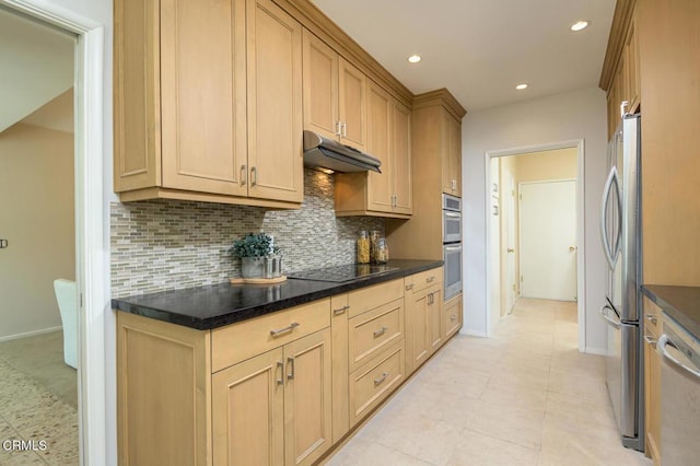 kitchen with stainless steel appliances, decorative backsplash, light brown cabinets, light tile patterned flooring, and dark stone countertops