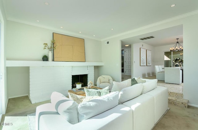 carpeted living room featuring ornamental molding, a fireplace, and a notable chandelier