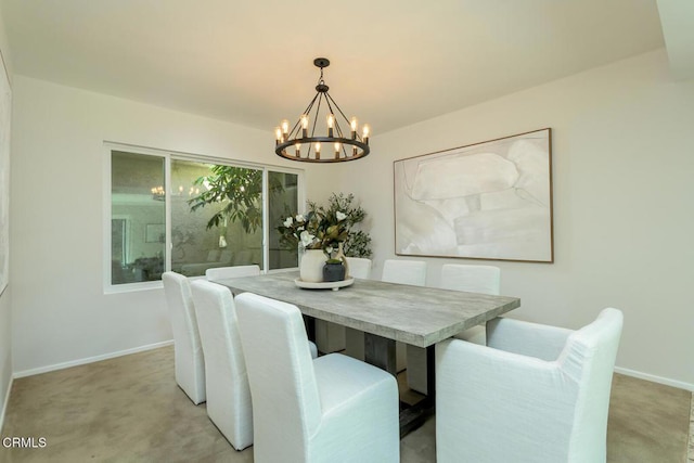 carpeted dining area featuring an inviting chandelier