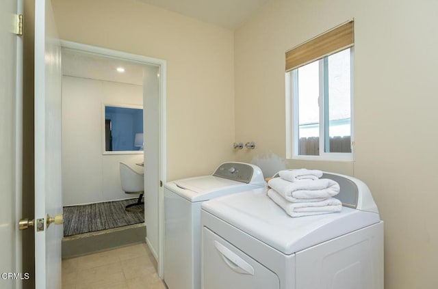 clothes washing area featuring independent washer and dryer