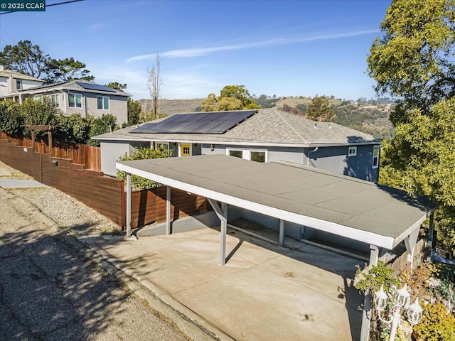 view of front of property with solar panels