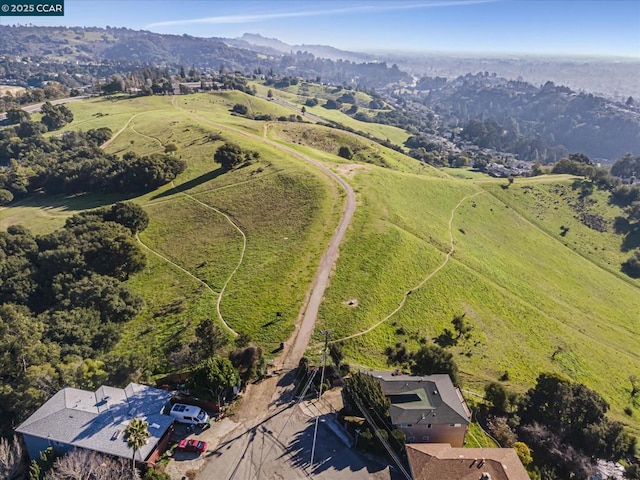 birds eye view of property with a rural view and a mountain view