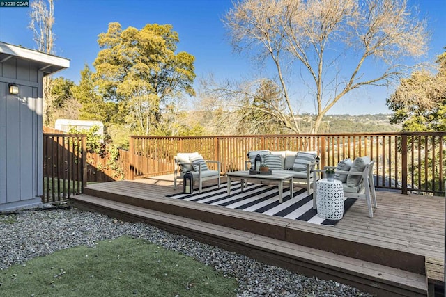 wooden deck with an outdoor living space