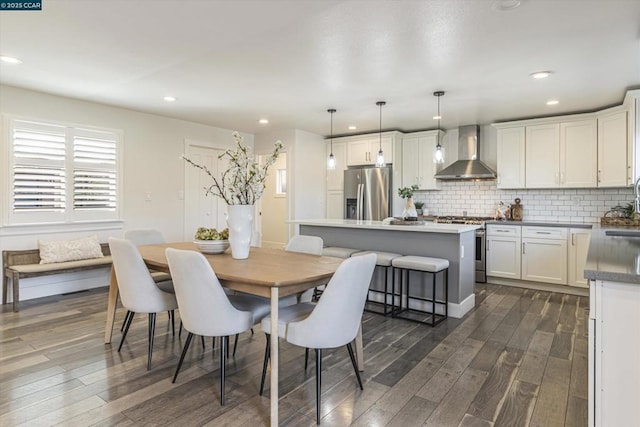 dining space with dark wood-type flooring and sink