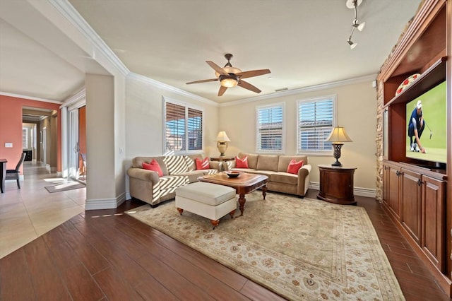 living room with ceiling fan, ornamental molding, dark hardwood / wood-style floors, and track lighting