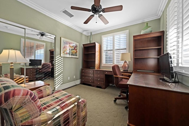 carpeted office with ceiling fan, crown molding, and a healthy amount of sunlight