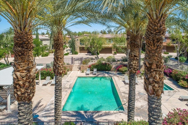 view of swimming pool featuring a patio area