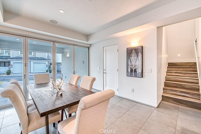 2618 Cove St, Corona Del Mar, CA 92625 - dining space with stairs, light tile patterned floors, a raised ceiling, and recessed lighting