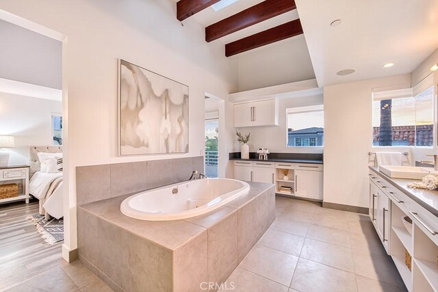2618 Cove St, Corona Del Mar, CA 92625 - bathroom featuring vanity, a whirlpool tub, beam ceiling, ensuite bath, and tile patterned flooring