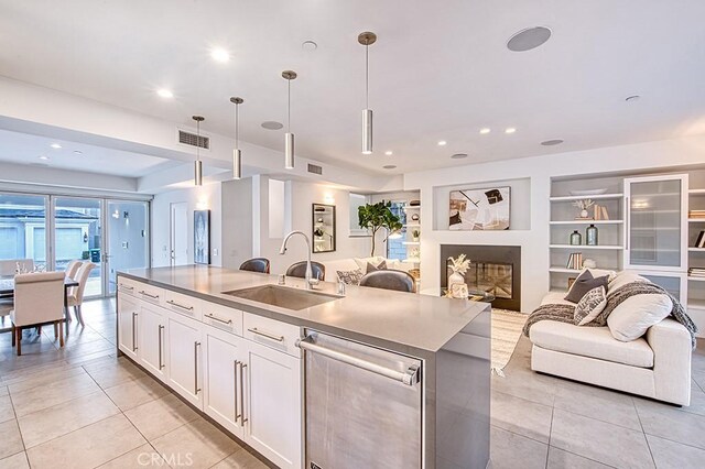 2618 Cove St, Corona Del Mar, CA 92625 - kitchen with dishwasher, a sink, open floor plan, light tile patterned flooring, and recessed lighting