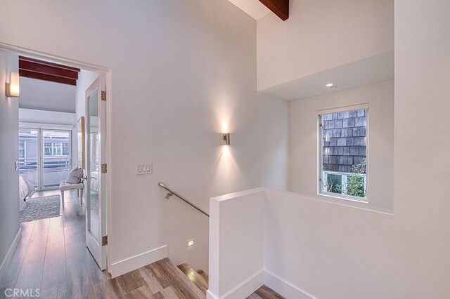 2618 Cove St, Corona Del Mar, CA 92625 - stairway with wood finished floors, baseboards, beam ceiling, and high vaulted ceiling