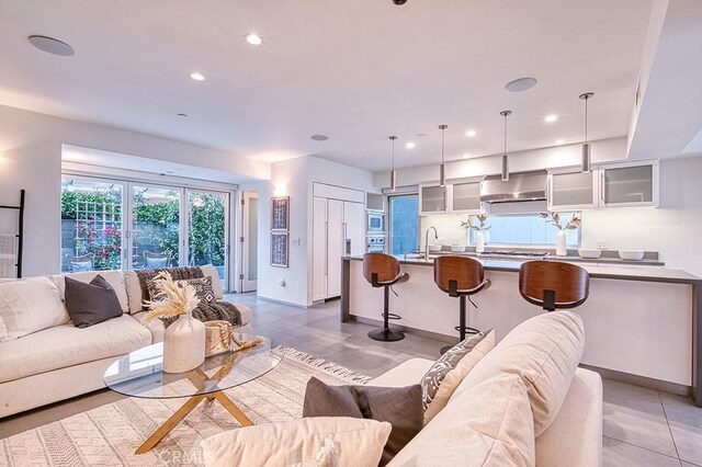 2618 Cove St, Corona Del Mar, CA 92625 - living area with light tile patterned flooring, recessed lighting, and baseboards