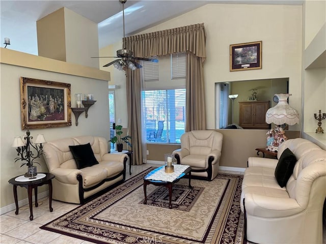 tiled living room with ceiling fan and vaulted ceiling