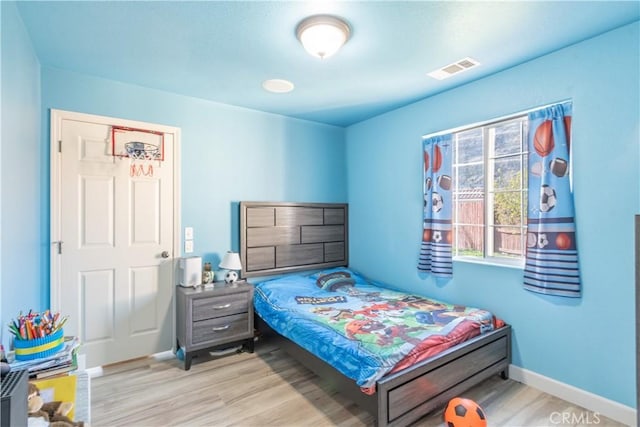 bedroom with light hardwood / wood-style flooring