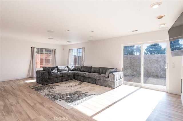 living room with light hardwood / wood-style flooring