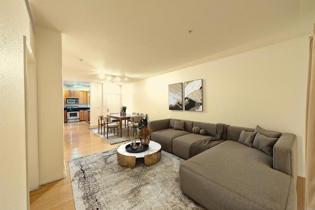 living room with light hardwood / wood-style floors