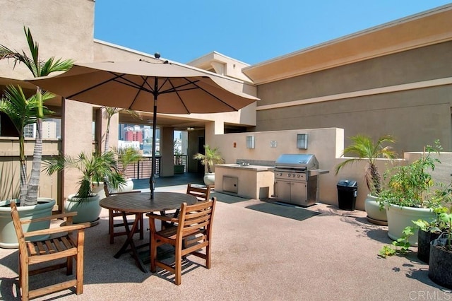 view of patio / terrace featuring sink, a grill, and area for grilling