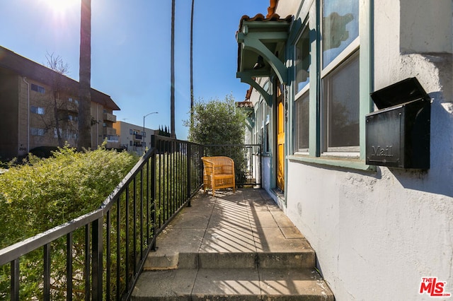 view of property exterior featuring a balcony