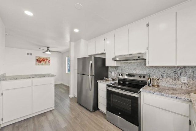 kitchen with ceiling fan, appliances with stainless steel finishes, backsplash, light wood-type flooring, and white cabinets