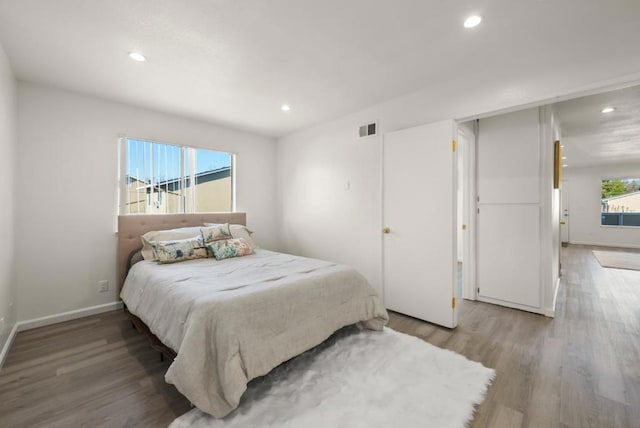 bedroom featuring hardwood / wood-style flooring