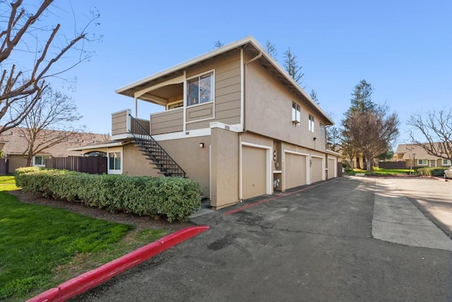 view of side of home featuring a garage