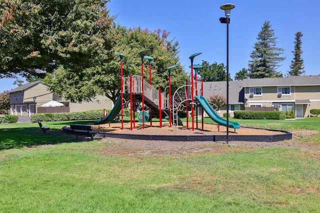 view of jungle gym with a lawn