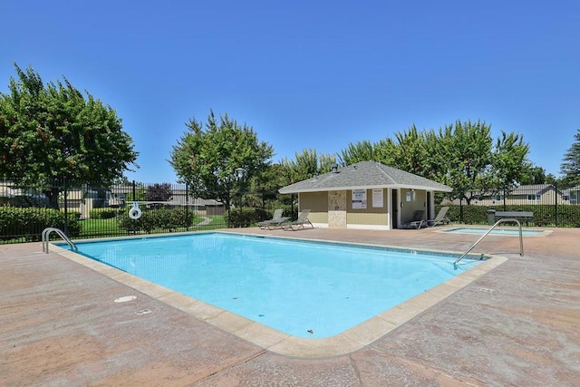 view of swimming pool featuring a patio