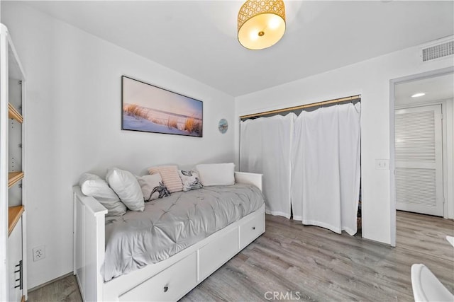 bedroom featuring light wood-type flooring