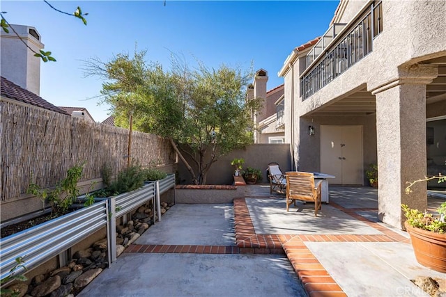 view of patio / terrace with a balcony