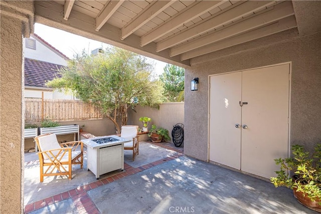 view of patio / terrace featuring an outdoor fire pit