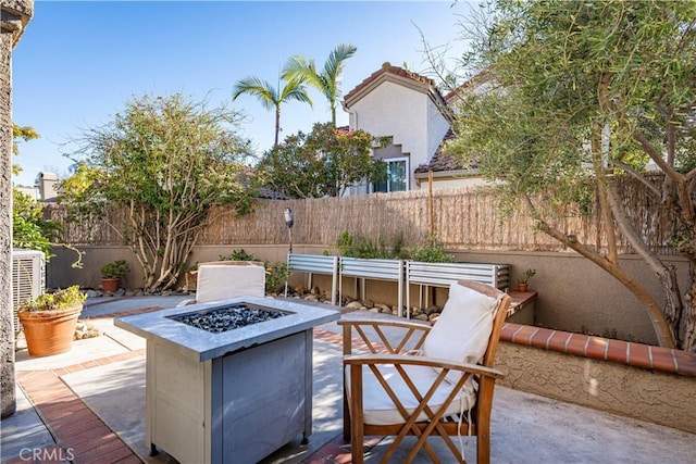 view of patio / terrace featuring a fire pit