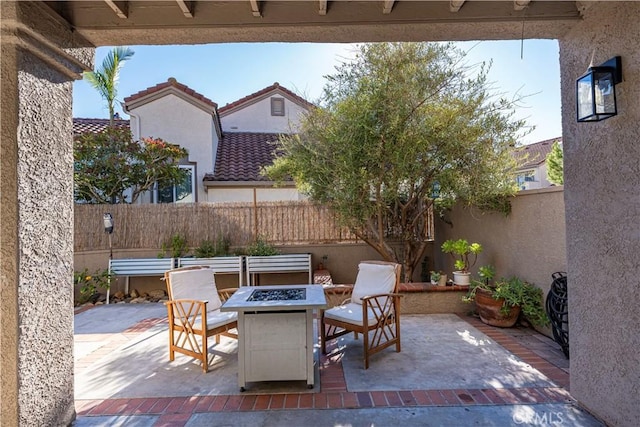 view of patio / terrace featuring a fire pit