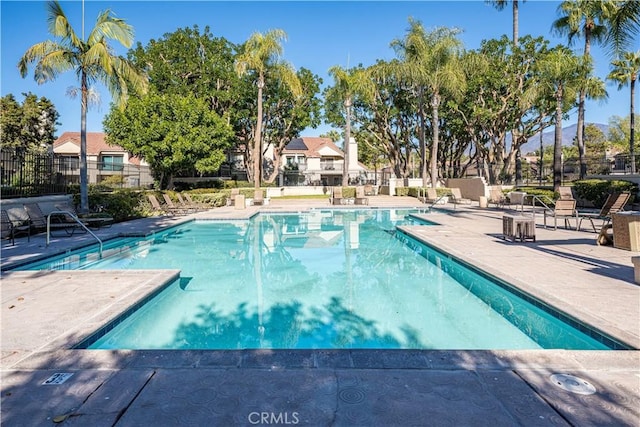 view of swimming pool with a patio