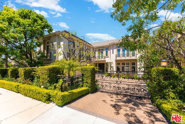 view of front of house featuring a balcony