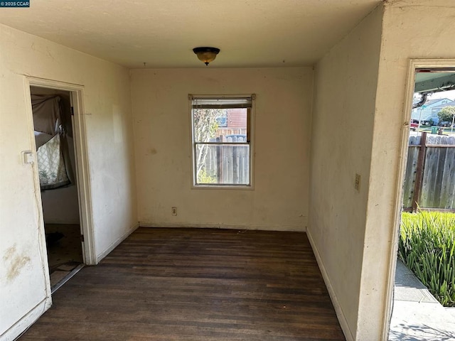 spare room featuring dark hardwood / wood-style flooring