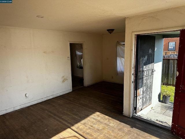 empty room featuring dark hardwood / wood-style flooring