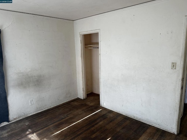 unfurnished bedroom with dark hardwood / wood-style floors