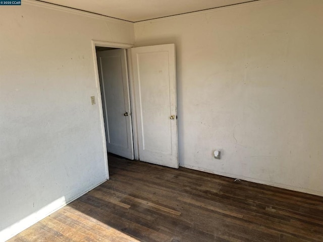 empty room featuring dark hardwood / wood-style floors