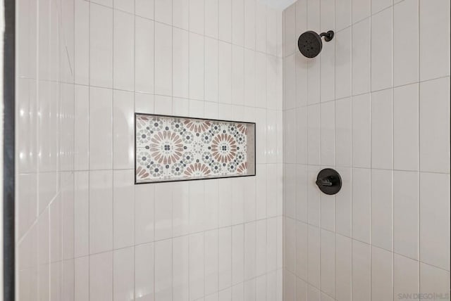 bathroom with a tile shower