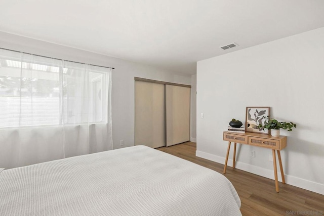 bedroom featuring a closet and hardwood / wood-style floors