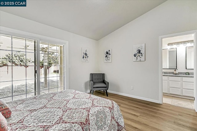 bedroom with access to exterior, ensuite bathroom, lofted ceiling, and light hardwood / wood-style flooring