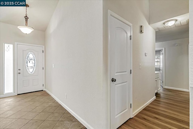 foyer entrance with tile patterned floors